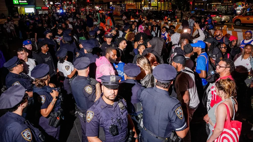 Karl-Anthony Towns of the Knicks commends the NYPD during lively watch parties for the NBA Finals.