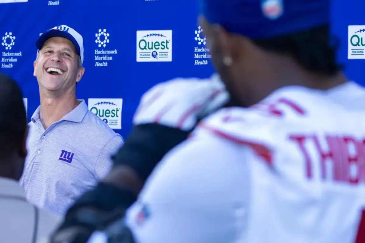 Kayvon Thibodeaux enjoys a light moment with John Harbaugh at the Giants press conference