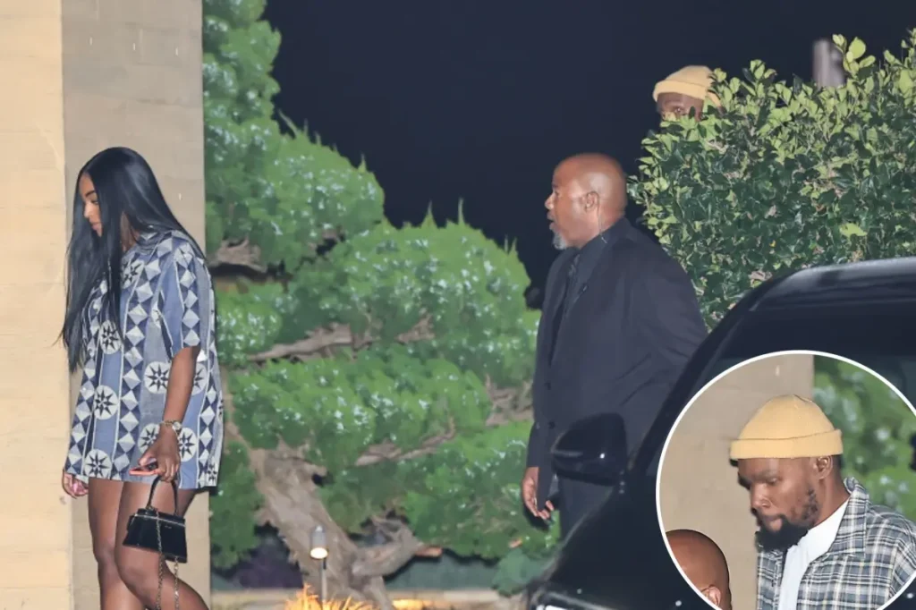 Kevin Durant attempts to avoid paparazzi while on a date with an unidentified woman.