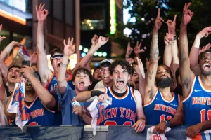 Knicks fans begin celebrating their NBA Finals victory with a crowded street takeover.