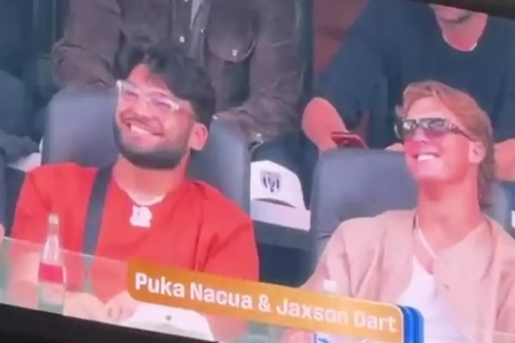 LA Rams player Puka Nacua enjoys a Coca-Cola alongside Jaxson Dart at a Team USA World Cup game after his rehab period.