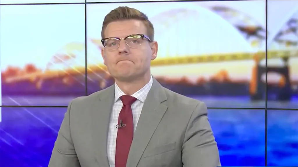 Local news anchor Dustin Nolan leaves KWQC TV6 during a live broadcast.