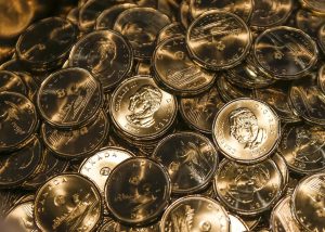 Loonie struggles with a sluggish home economy and a rising U.S. dollar