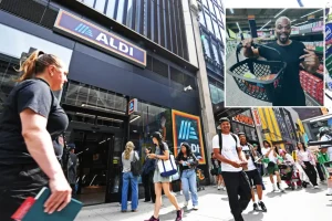 Many shoppers wait in line at Times Square to see the new Aldi supermarket.
