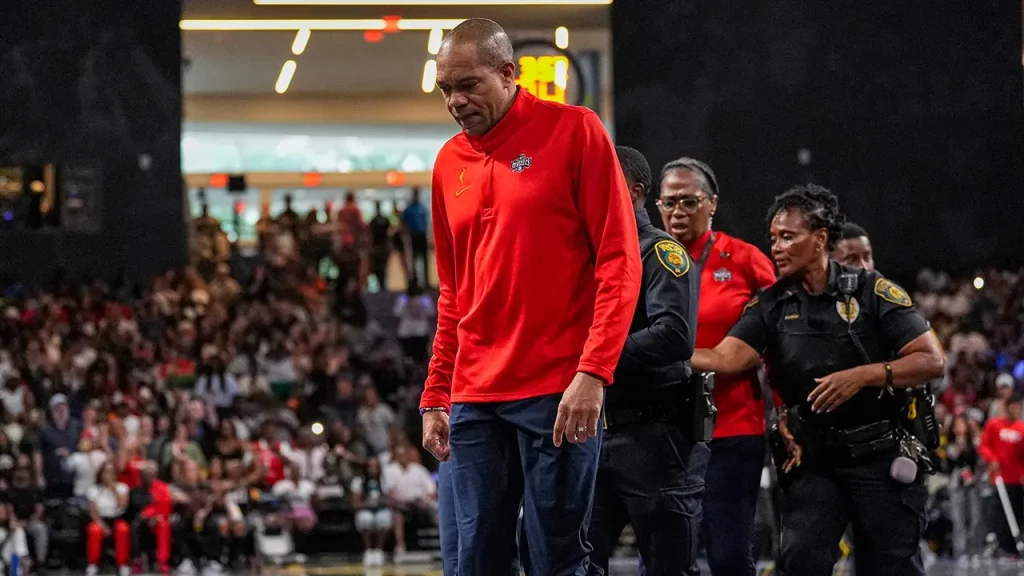 Mystics coach taken off the court by police after being ejected for a decision.