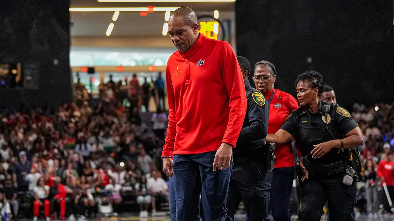 Mystics coach taken off the court by police after being ejected for a decision.