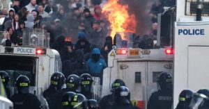 Northern Ireland Anti-Migration Protesters Battle Police and Ignite Vehicles