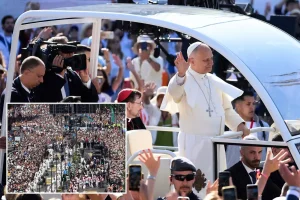 One million people fill the streets of Madrid to witness the pope's procession adorned with flowers.