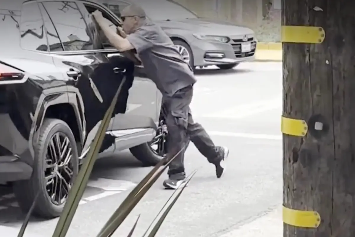 Person spotted clinging to the side of a car during a road rage altercation in San Francisco