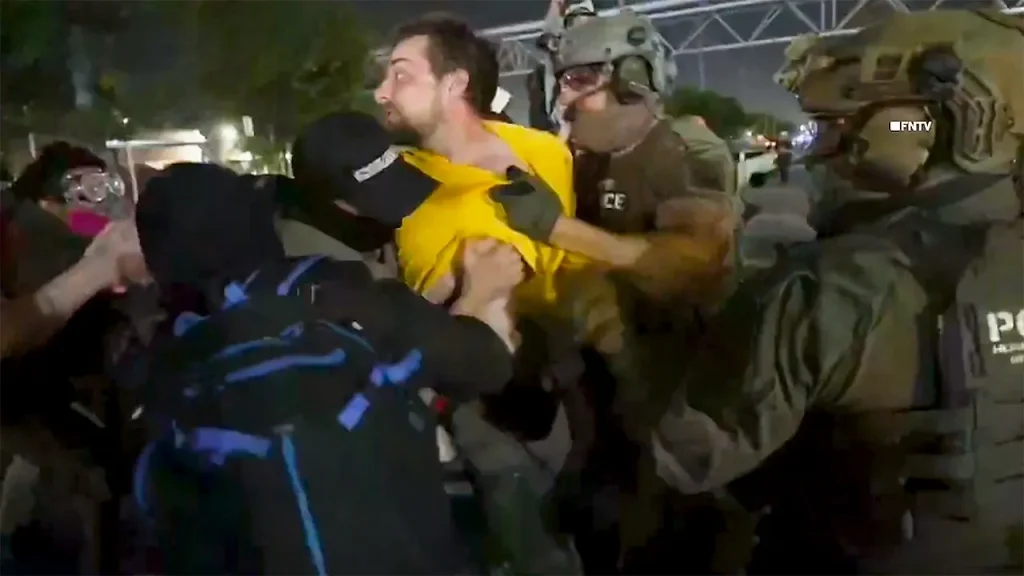 Protesters against ICE taken into custody at Delaney Hall during tense clashes