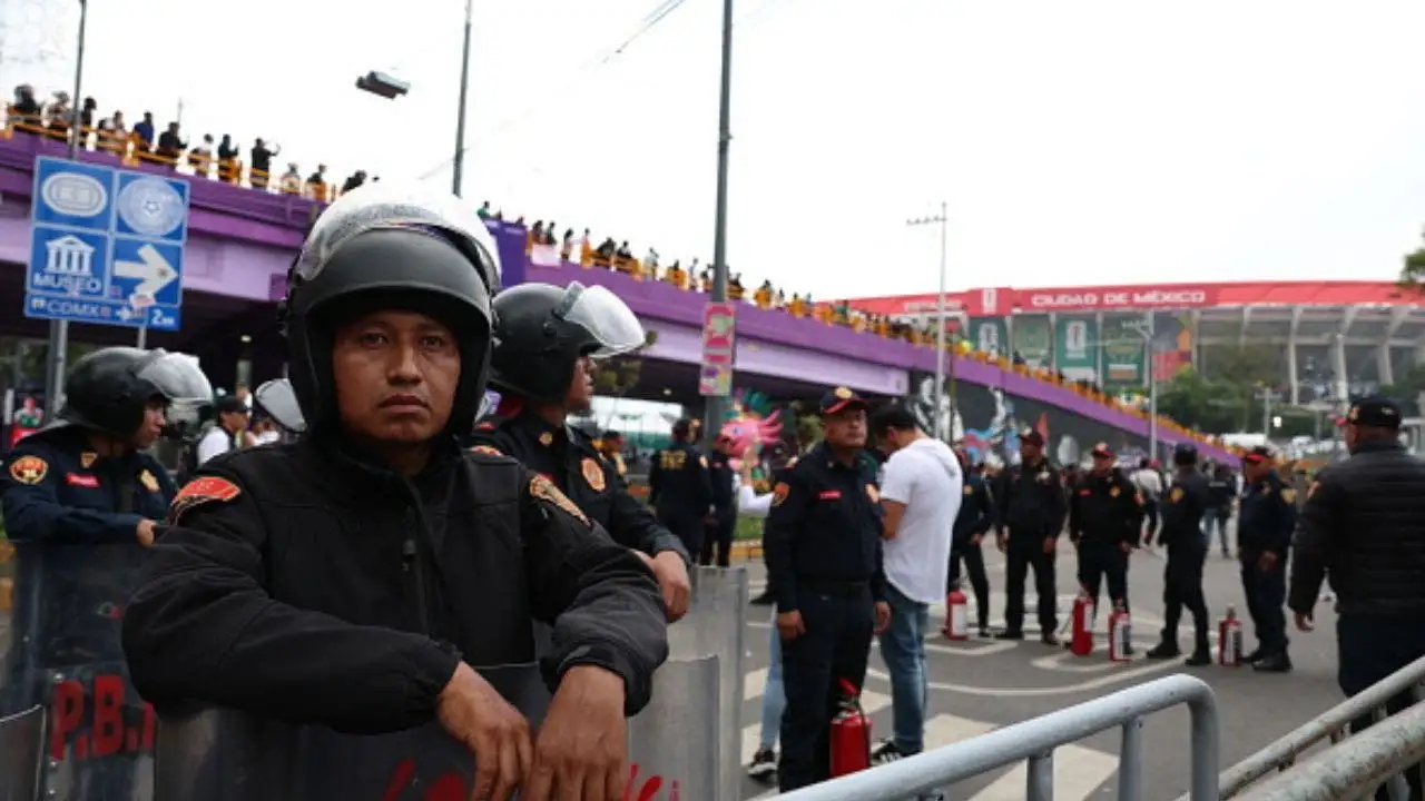 Protesters against the government confront riot police outside the World Cup opening as Shakira performs inside