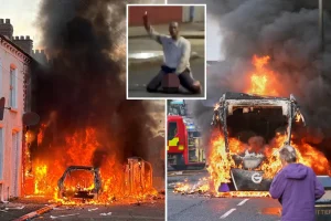 Protesters set vehicles and houses on fire as Belfast erupts over a violent knife attack on a migrant.