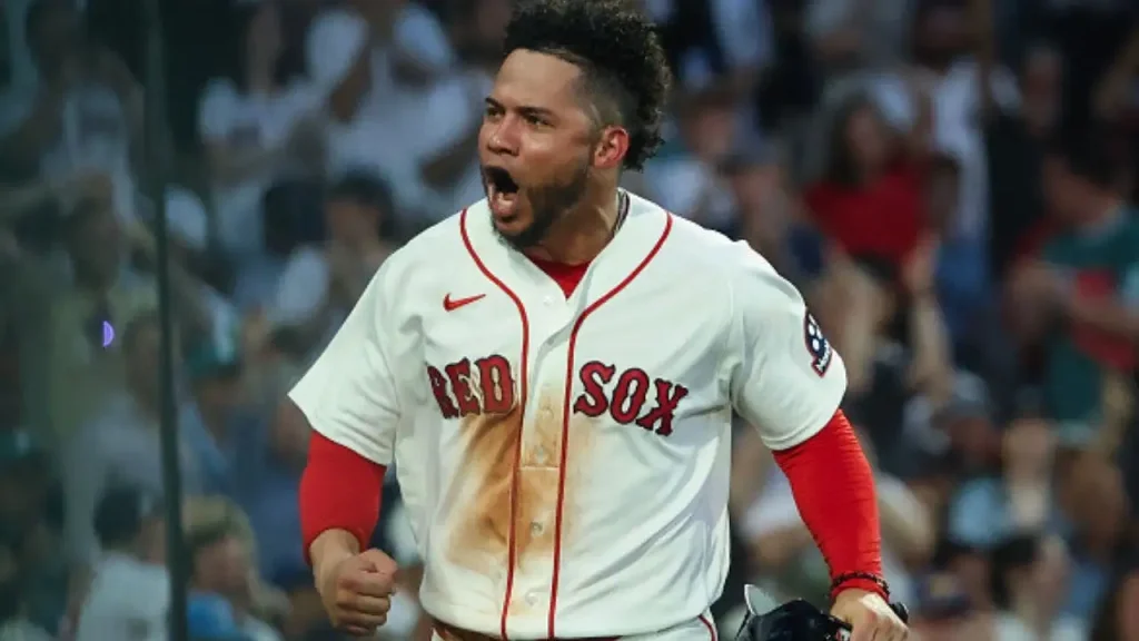 Red Sox player cries for earthquake-affected Venezuela after hitting a home run, then is ejected by the umpire shortly after.