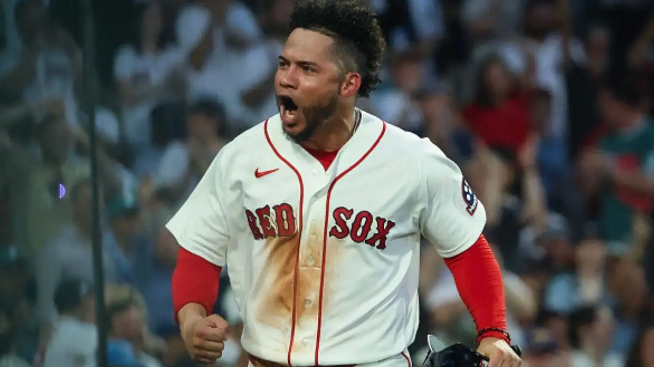Red Sox player cries for earthquake-affected Venezuela after hitting a home run, then is ejected by the umpire shortly after.