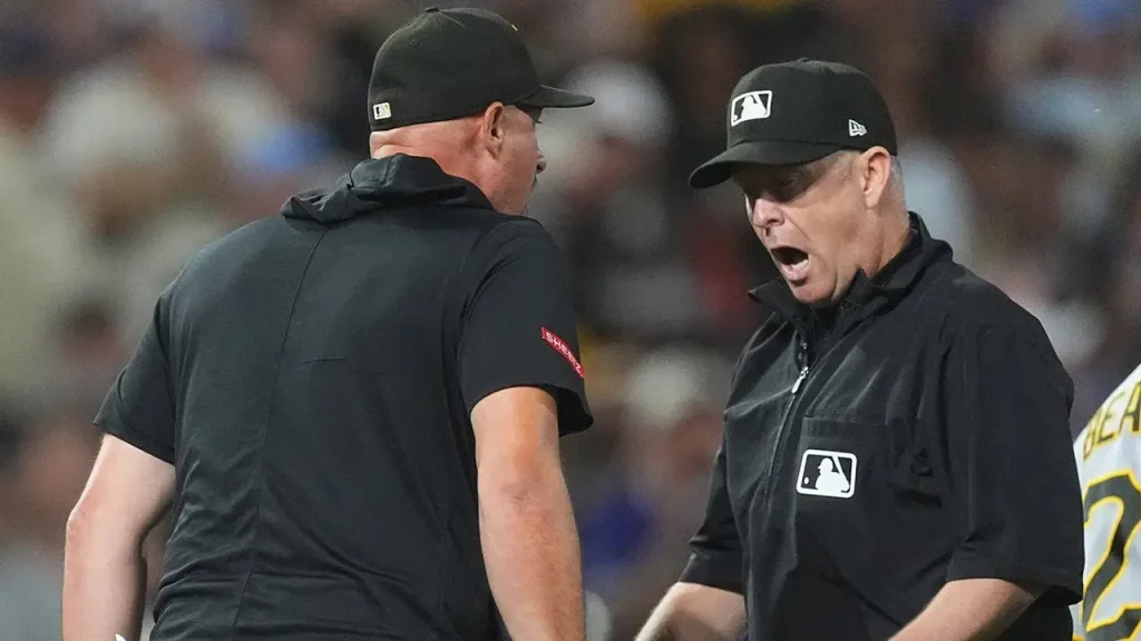 Rockies defeat Pirates due to a disputed interference call in the 9th inning.