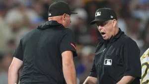 Rockies defeat Pirates due to a disputed interference call in the 9th inning.