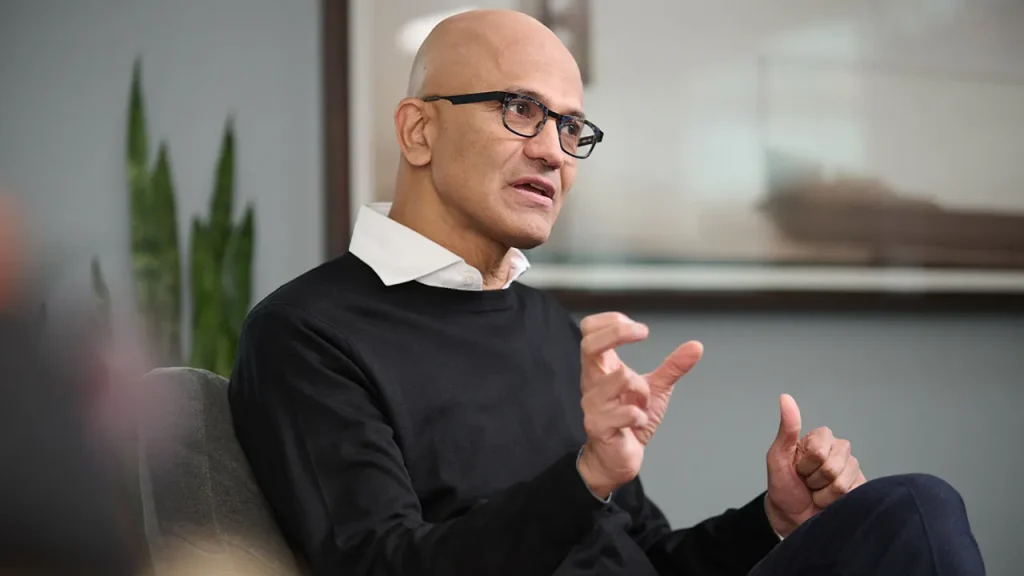 Satya Nadella emphasizes the need for AI companies to build public trust regarding their effect on employment.