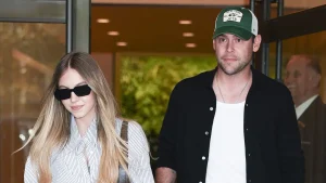 Scooter Braun and Sydney Sweeney ride bikes to Times Square on a night out