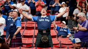 Scotland's Tartan Army soccer fans transformed the Red Sox game at Fenway Park into a celebration with bagpipes and singing.