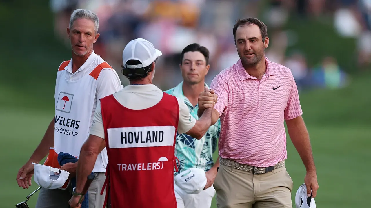 Scottie Scheffler sinks crucial putt to push for a sudden-death playoff against Viktor Hovland at Travelers.