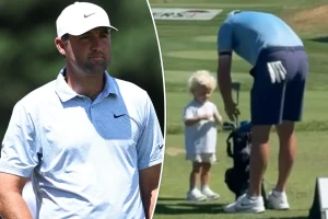 Scottie Scheffler’s son Bennett carries a small golf bag at the Travelers Championship