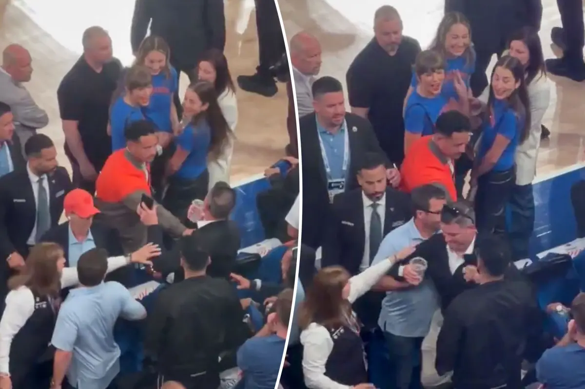 Security prevents fan from approaching Taylor Swift before Knicks' thrilling comeback in NBA Finals