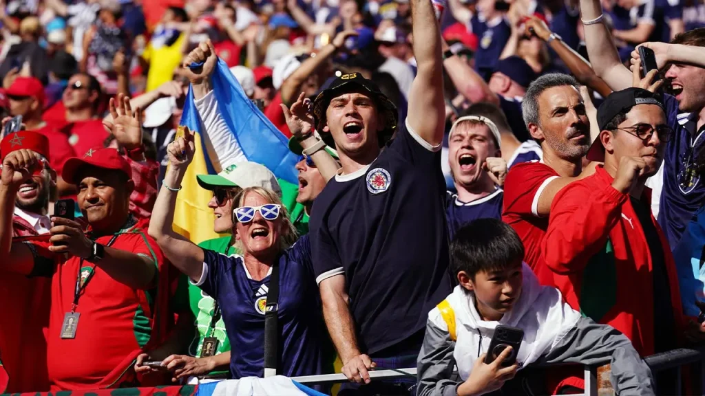Tartan Army parades through the streets reminiscent of 'Braveheart' before the game against Morocco