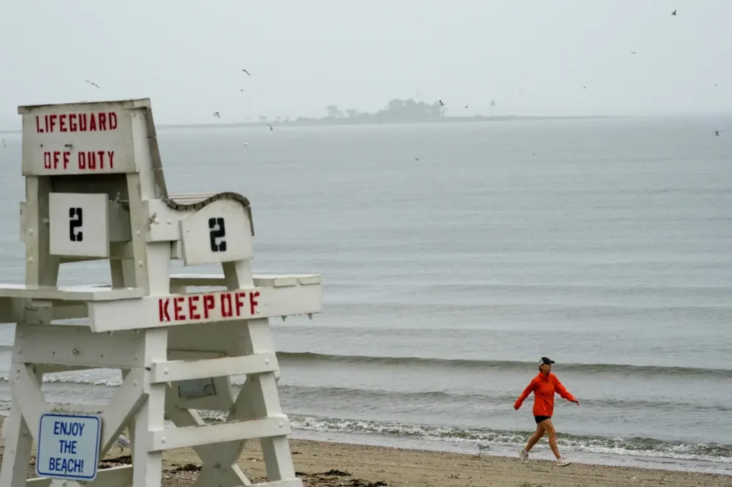 Two fishermen saved, one still unaccounted for after high tide leaves them stranded on reef at Connecticut beach.