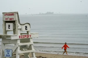 Two fishermen saved, one still unaccounted for after high tide leaves them stranded on reef at Connecticut beach.