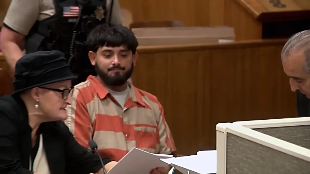 Undocumented immigrant charged with triple murder smiles in California court