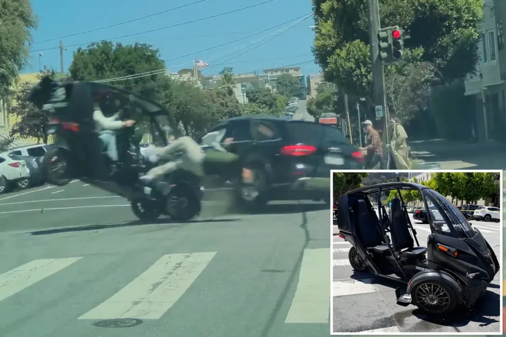 Video captures driver thrown from three-wheeler after collision with Audi at intersection.