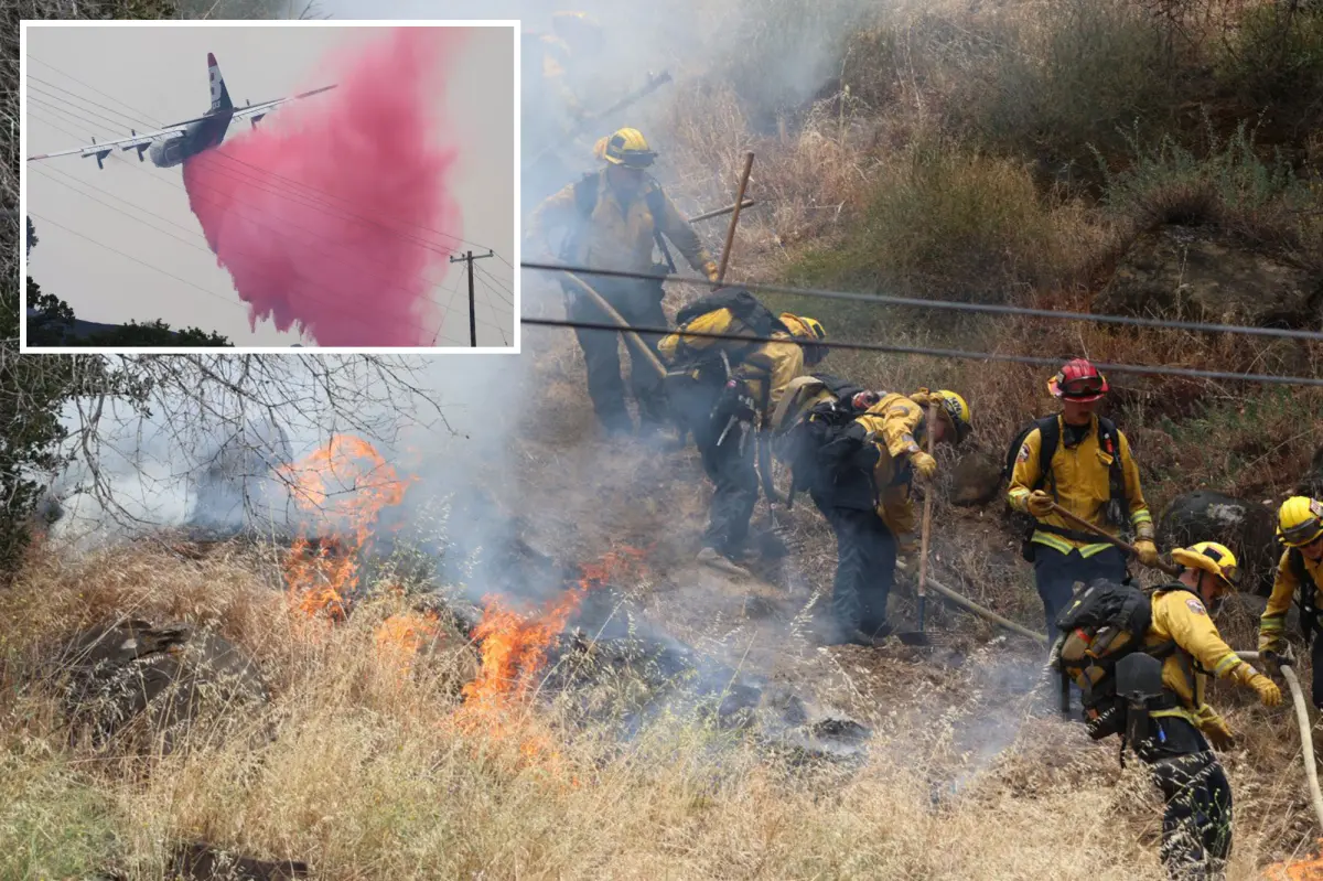 Wildfire spreads rapidly through Wine Country as firefighters contend with heavy winds and steep terrain.