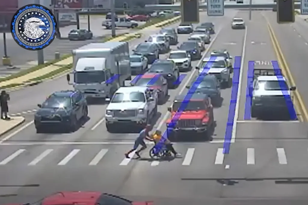 20-year-old superhero dressed as Spider-Man helps a man in a wheelchair cross six lanes of traffic safely