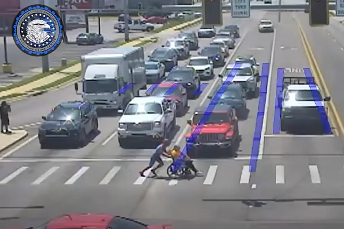 20-year-old superhero dressed as Spider-Man helps a man in a wheelchair cross six lanes of traffic safely