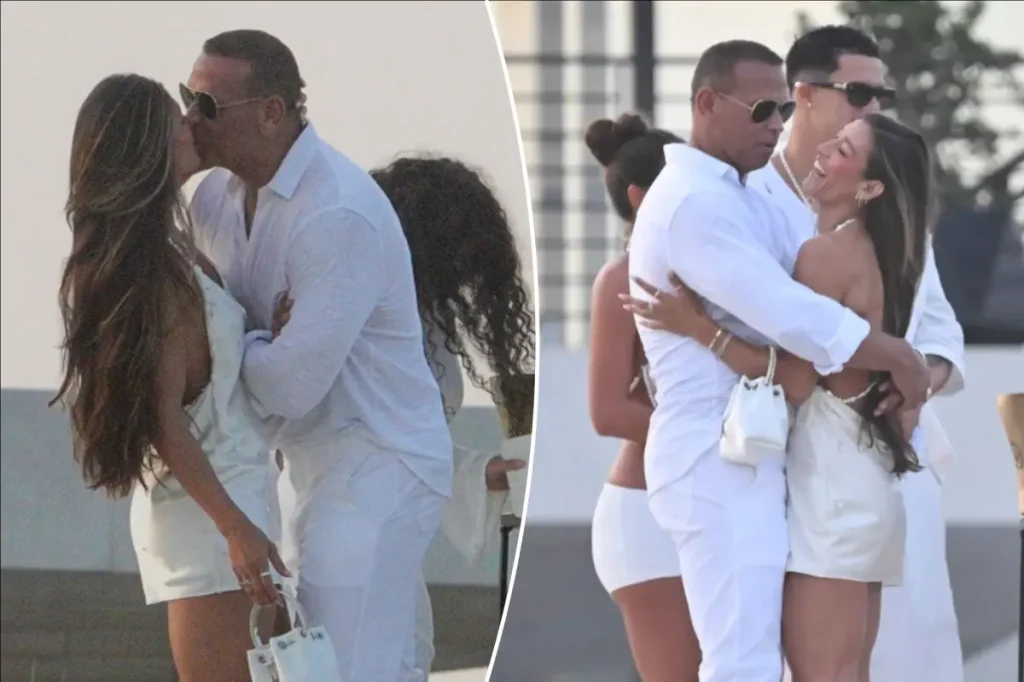 Alex Rodriguez shares a kiss with a woman at Michael Rubin's white party