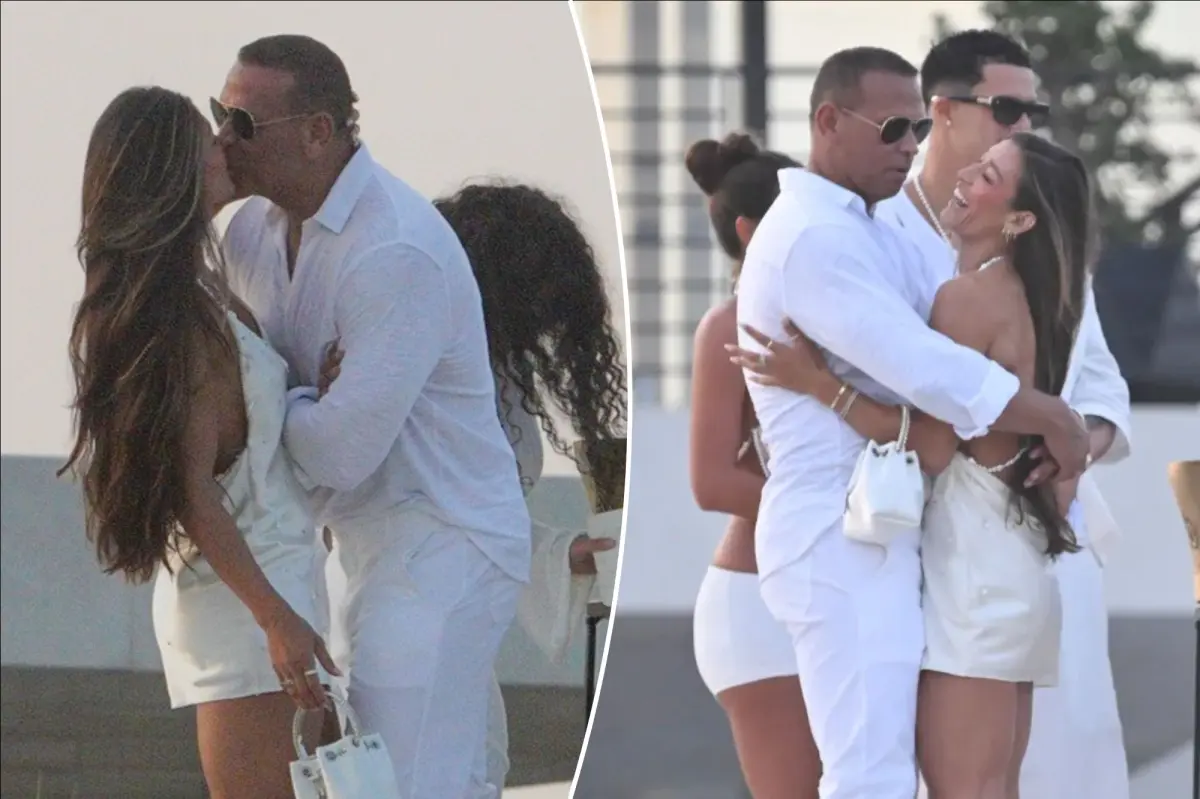Alex Rodriguez shares a kiss with a woman at Michael Rubin's white party