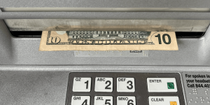 Elderly Air Force veteran attacked and robbed after getting cash from ATM; footage shows young person taking the victim's wallet.