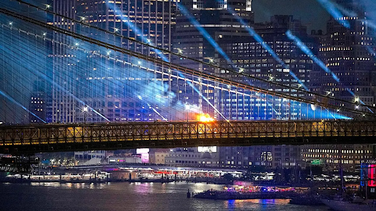 Fire erupts on the Brooklyn Bridge during the July Fourth fireworks celebration