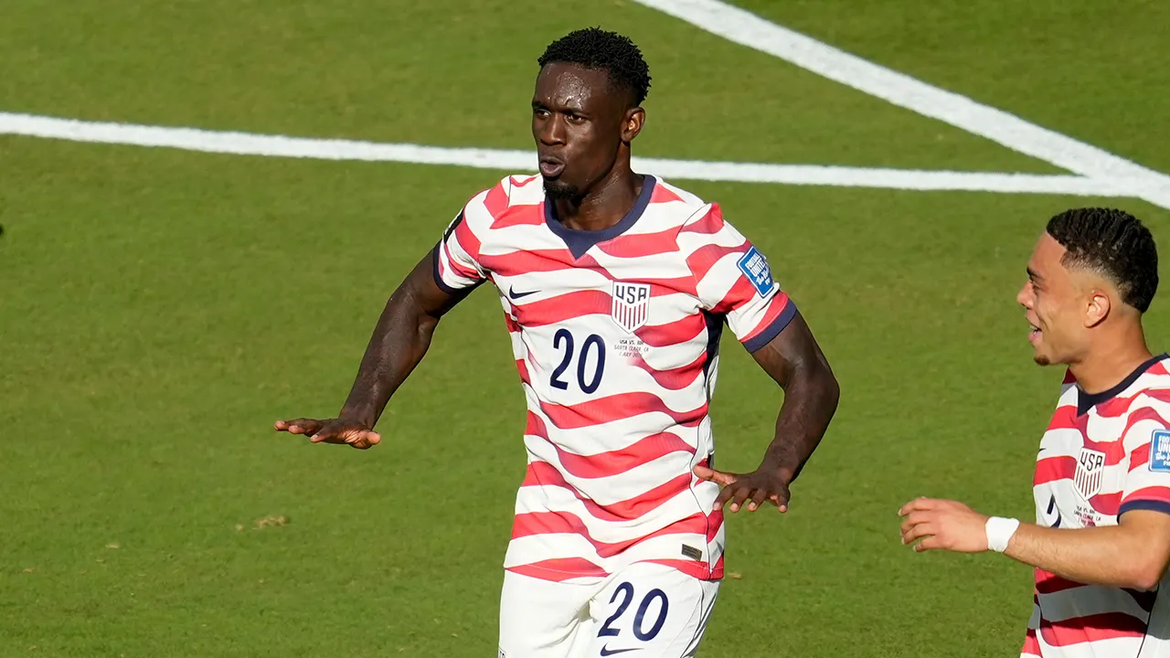 Folarin Balogun scores and performs the LeBron James silencer gesture in celebration