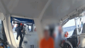 Footage captures Coast Guard taking Brian Hooker's sailboat following his wife's disappearance.