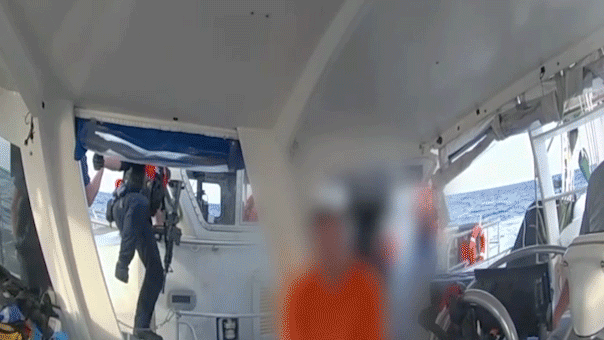 Footage captures Coast Guard taking Brian Hooker's sailboat following his wife's disappearance.