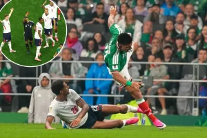Jarrell Quansah from England receives a red card following FIFA's controversial decision on Folarin Balogun