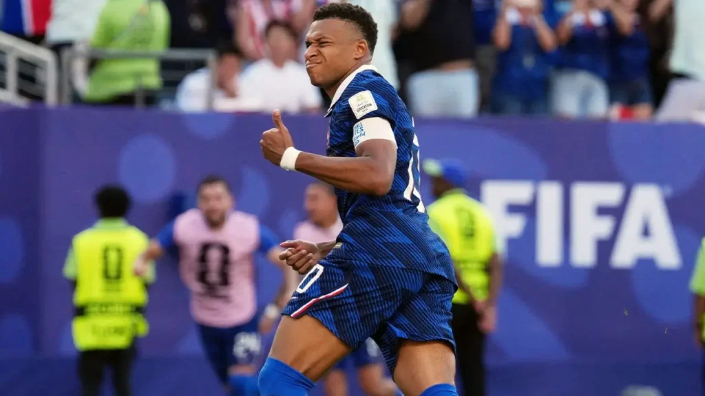 Mbappé scores his seventh World Cup goal, matching Messi and helping France advance.