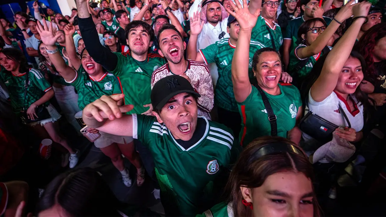 Mexican soccer fans celebrate their World Cup advancement with spontaneous boxing matches.