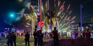 More than 400 detained following July 4 TikTok event in beach town results in brawls, theft, property damage, and assaults on police.