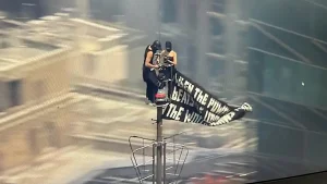 Two individuals climb the Empire State Building in New York City