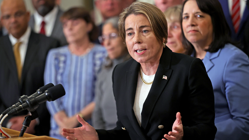 Woman manages Massachusetts booth after governor withdraws from Great American State Fair.