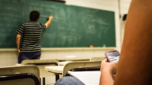 Brown University professor says the institution has been slow to respond to the AI cheating scandal.