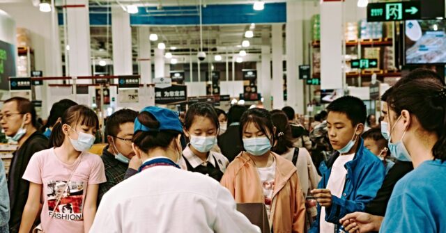China Reinstates Mask Use for At-Risk Individuals Amid Summer Surge of Coronavirus in the South