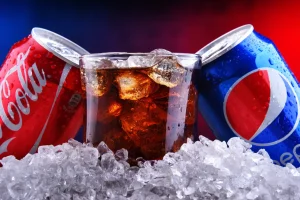 Coke outperforms Pepsi on Wall Street as expensive snacks hurt stock prices.